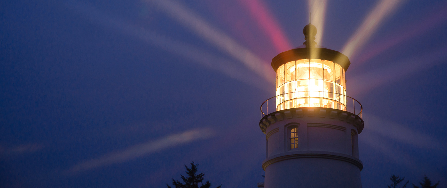 Lighthouse lit up at night