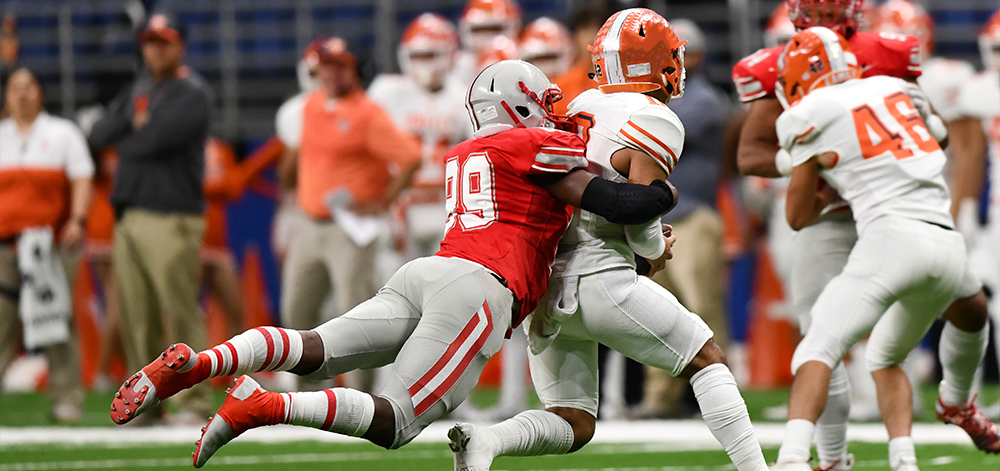 Football players tackling