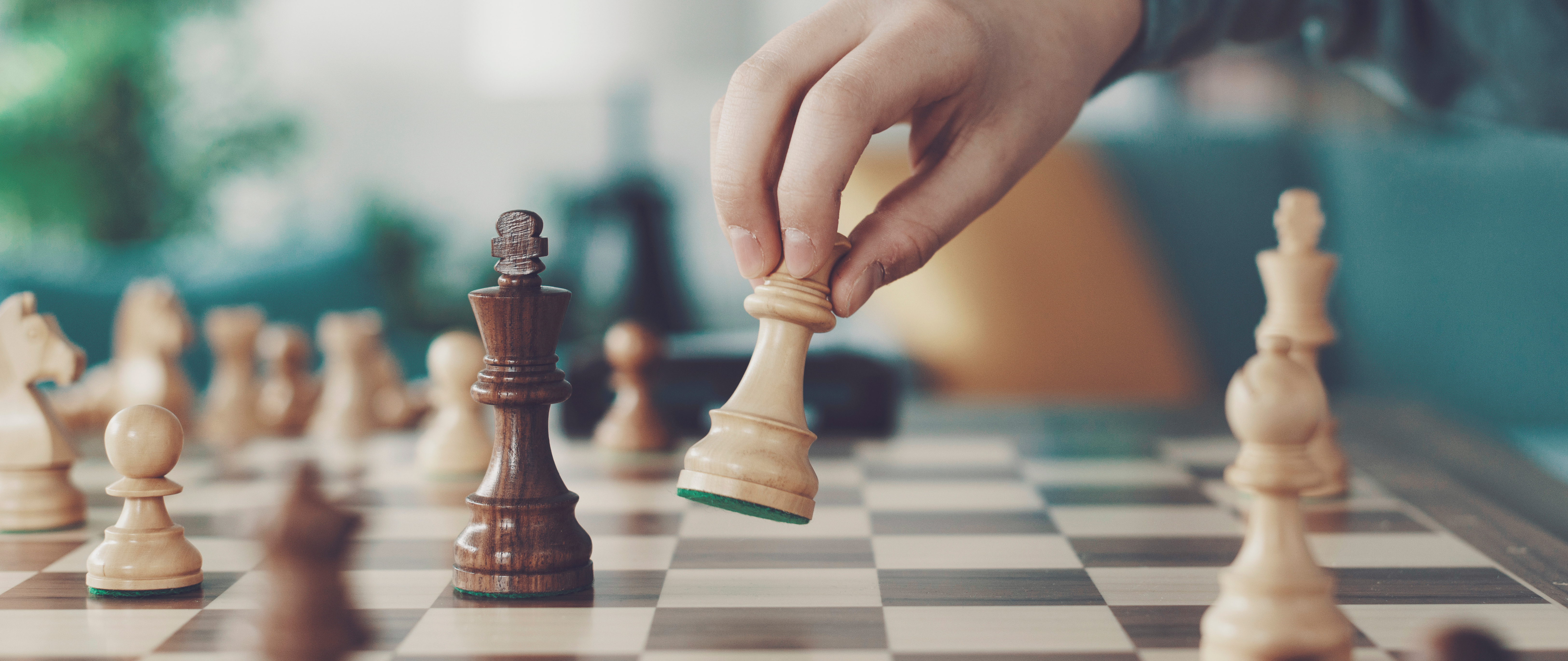 Hand moving chess pieces. 