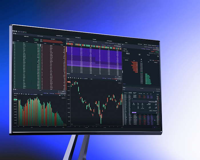 Power E*TRADE Pro desktop trading app on a monitor showing advanced charting and trading tools