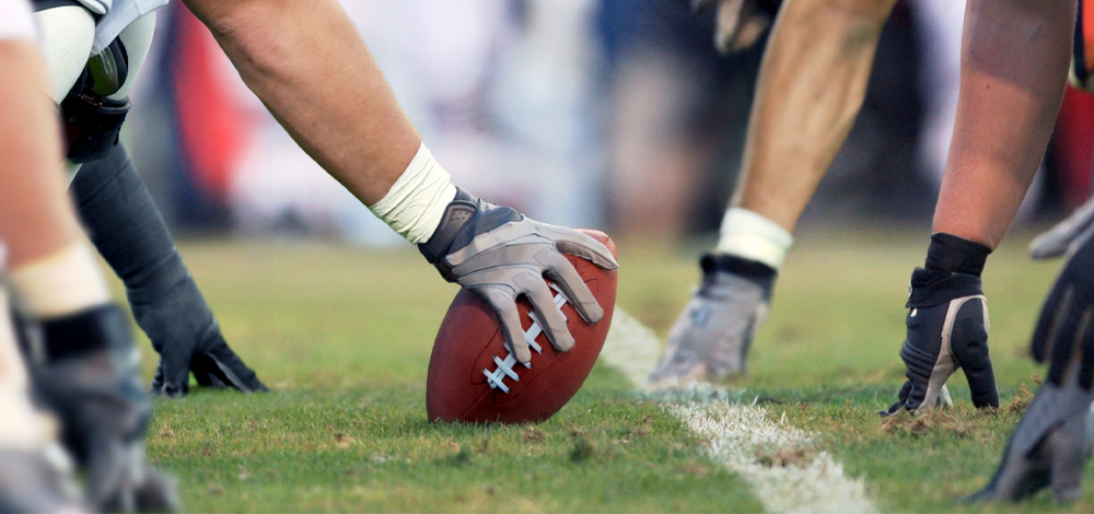 Image of footballer starting the ball